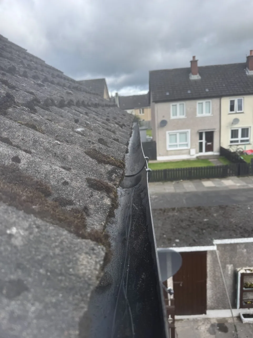 The same back gutter vacuumed out and clear