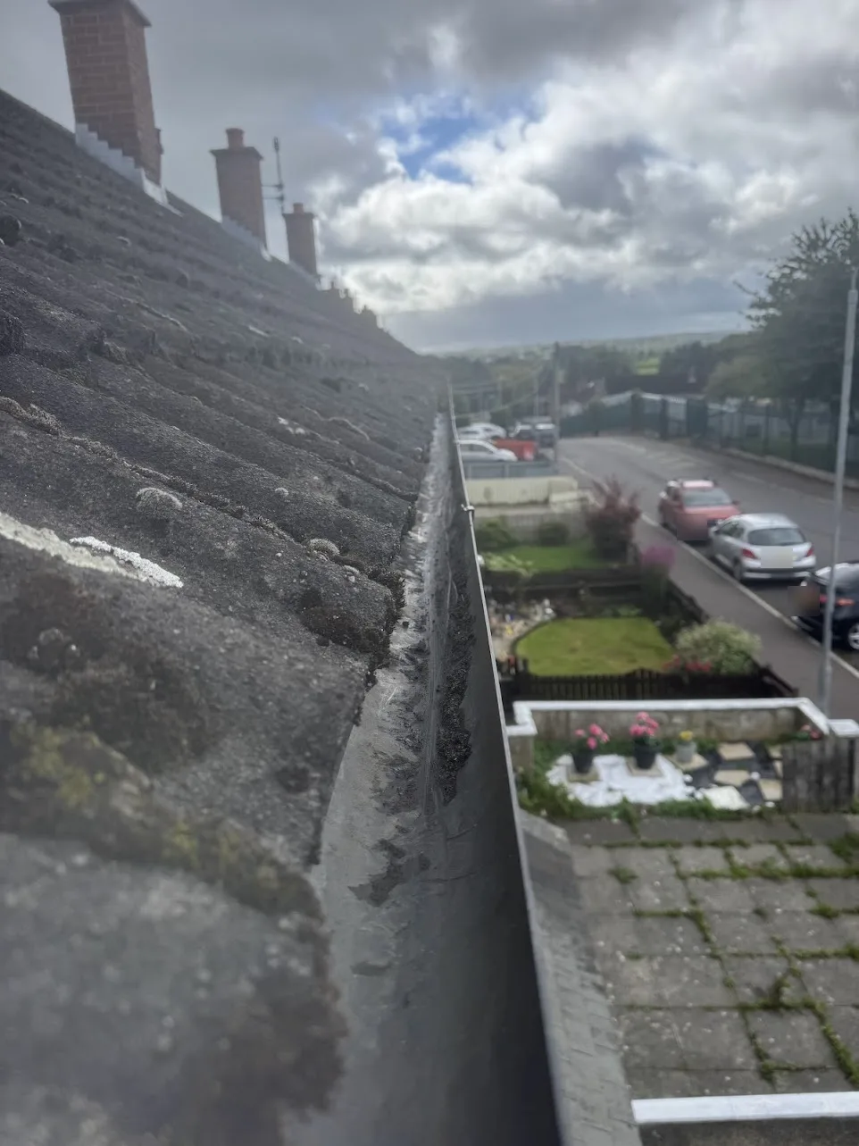 The same front gutter cleared out after vacuuming